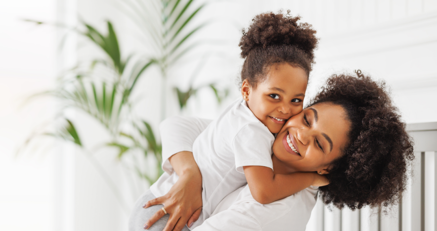 woman holding her daughter