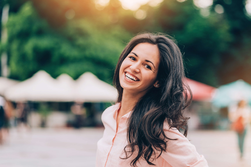 Woman smiling with long brown hair