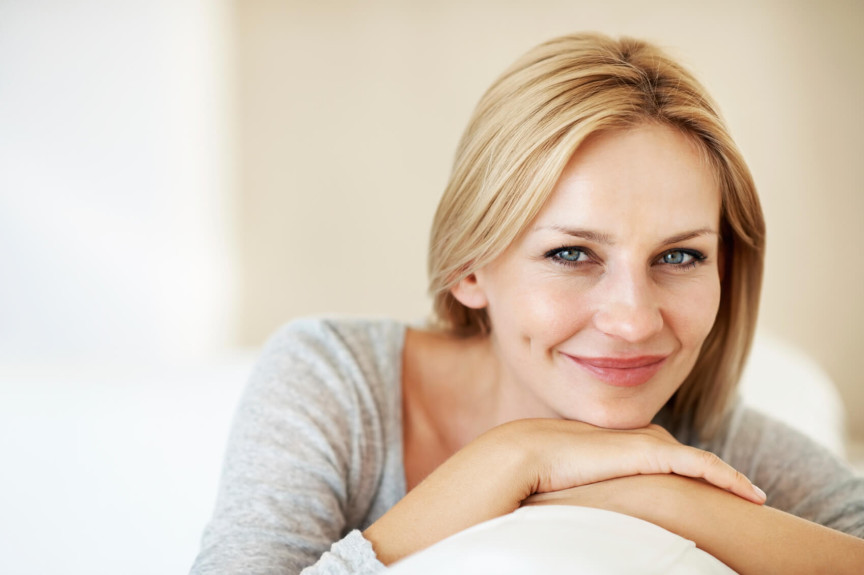 Woman smiling on couch