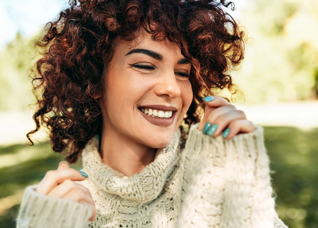 Smiling female sitting outside